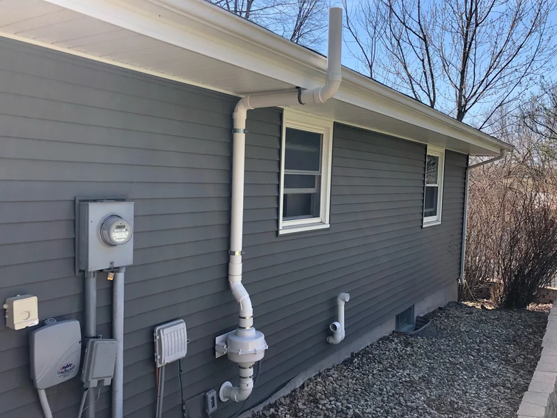 Radon mitigation system installed on a Minnesota home